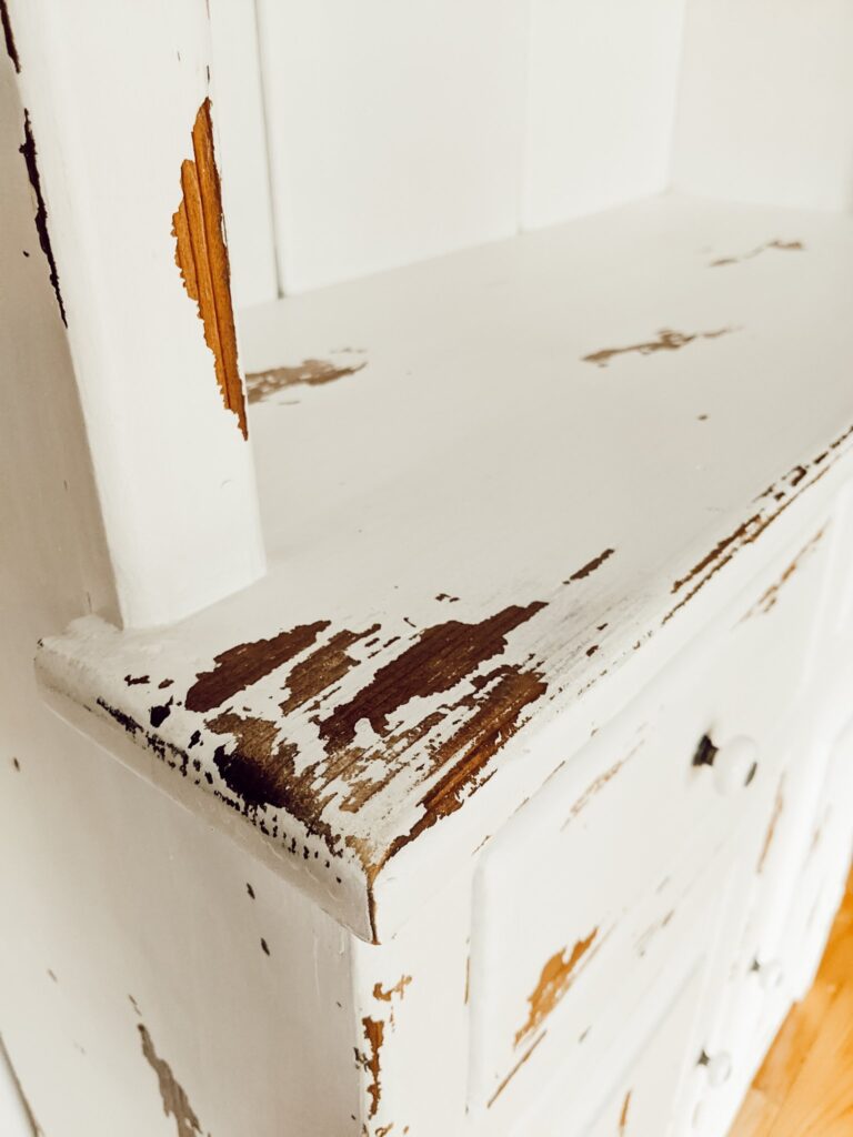 chippy white painted cabinet