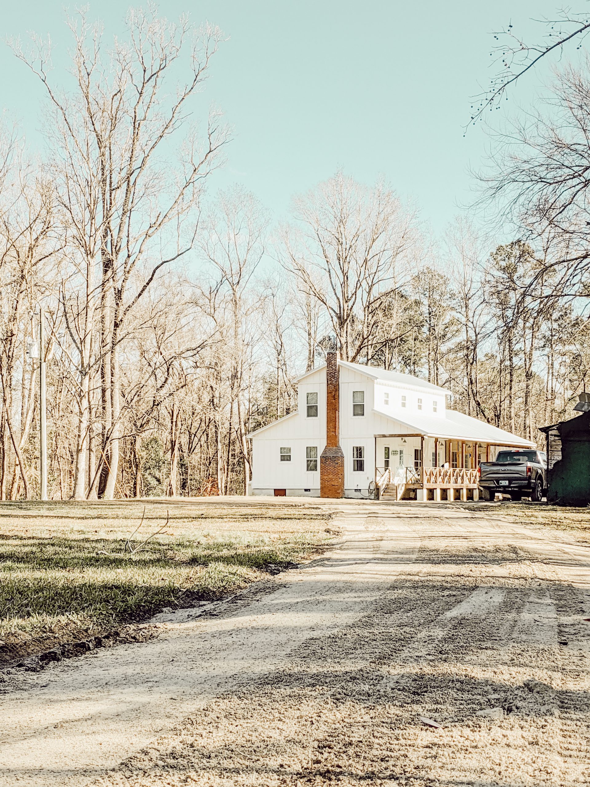 renovated farmhouse at the end of an old dirt road