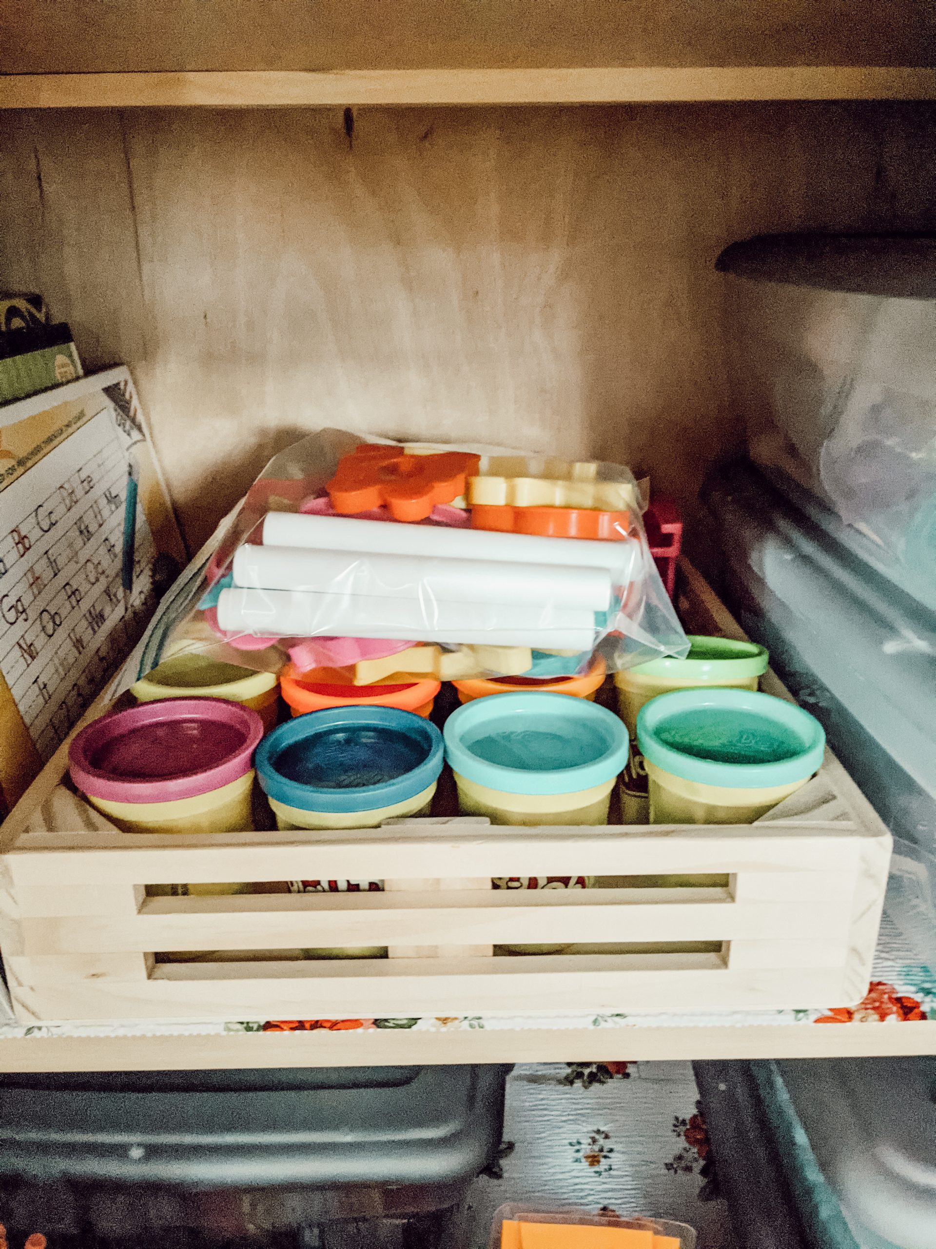 playdough storage caddy in kitchen cabinet