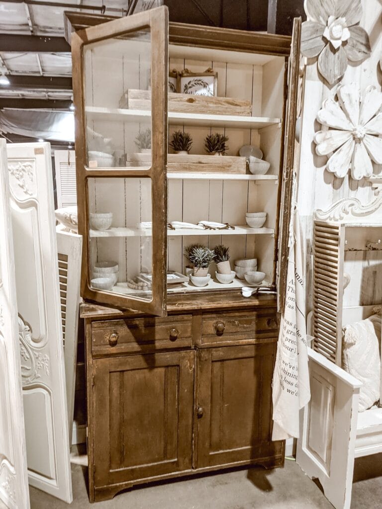 white and wood painted cabinet at vintage market days