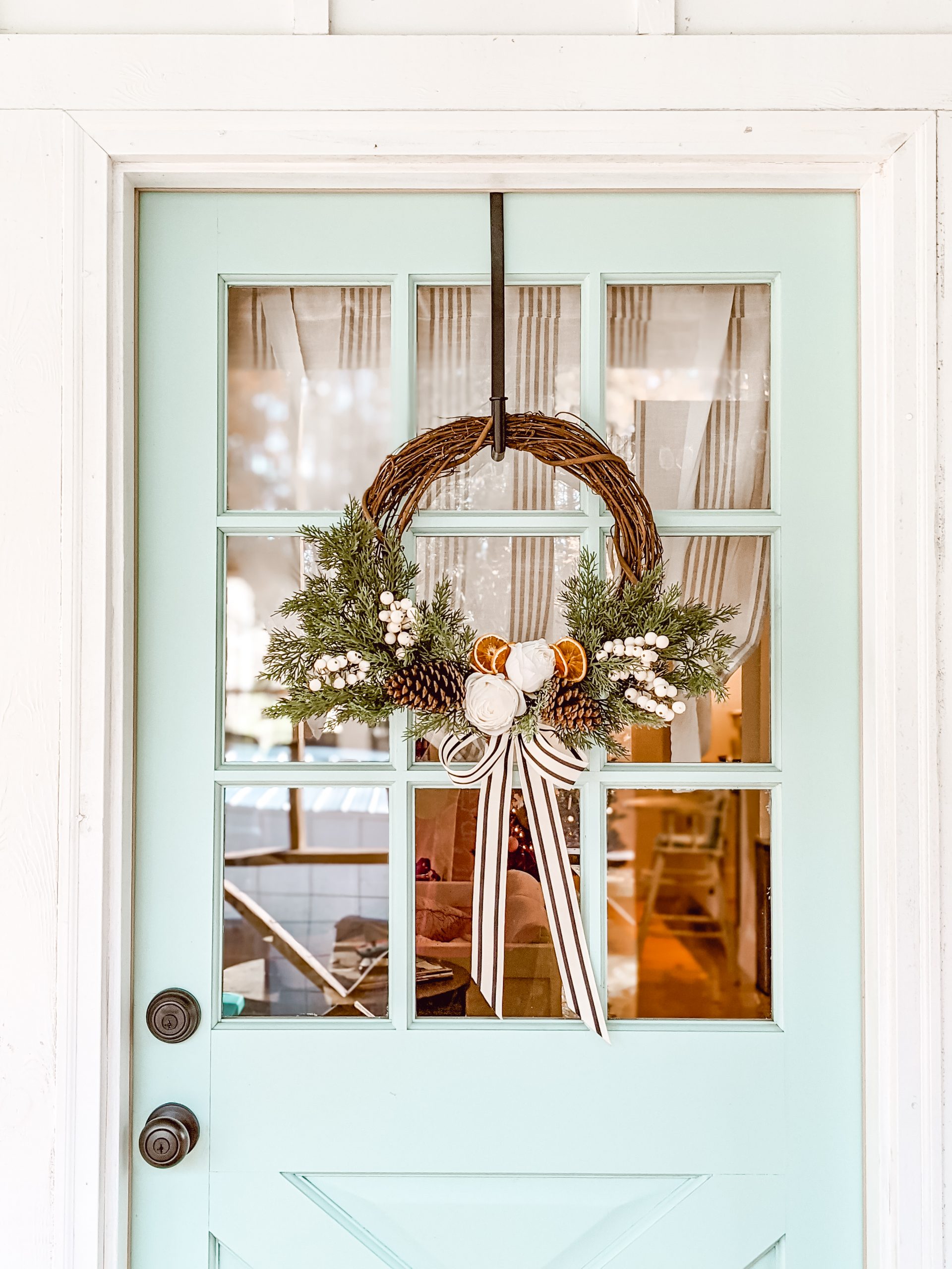 cozy classic Christmas wreath on blue porch door
