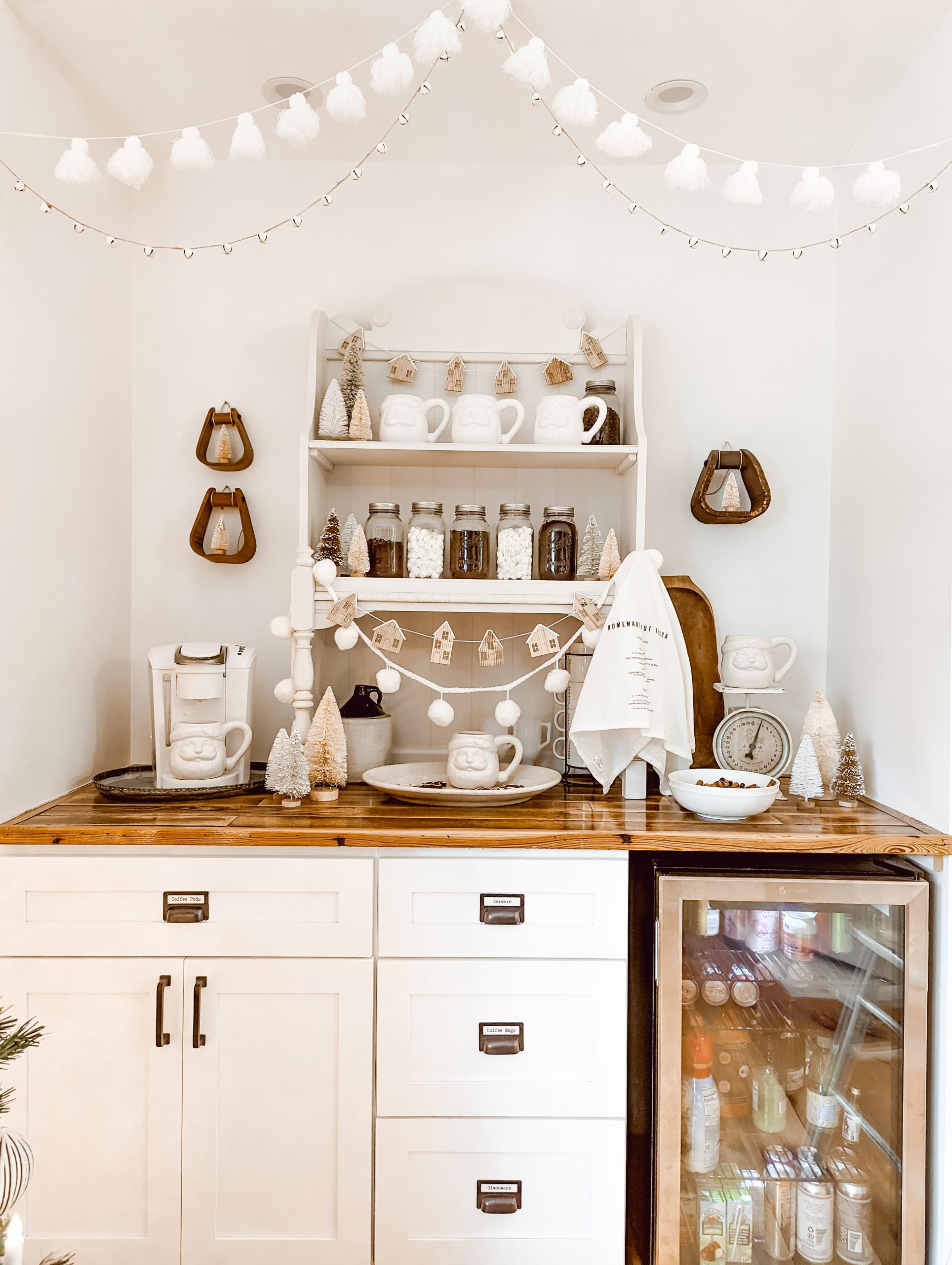 neutral Christmas coffee bar with white Santa mugs and vintage wood decor