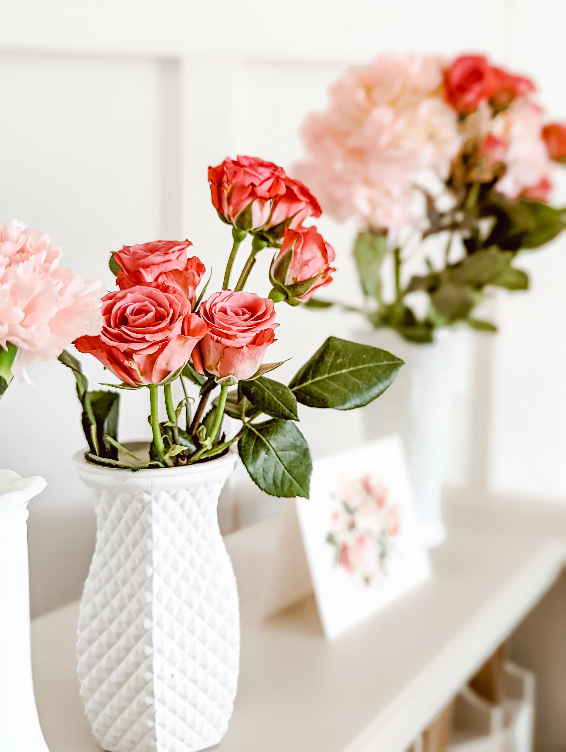 milk glass bud vases and pink roses