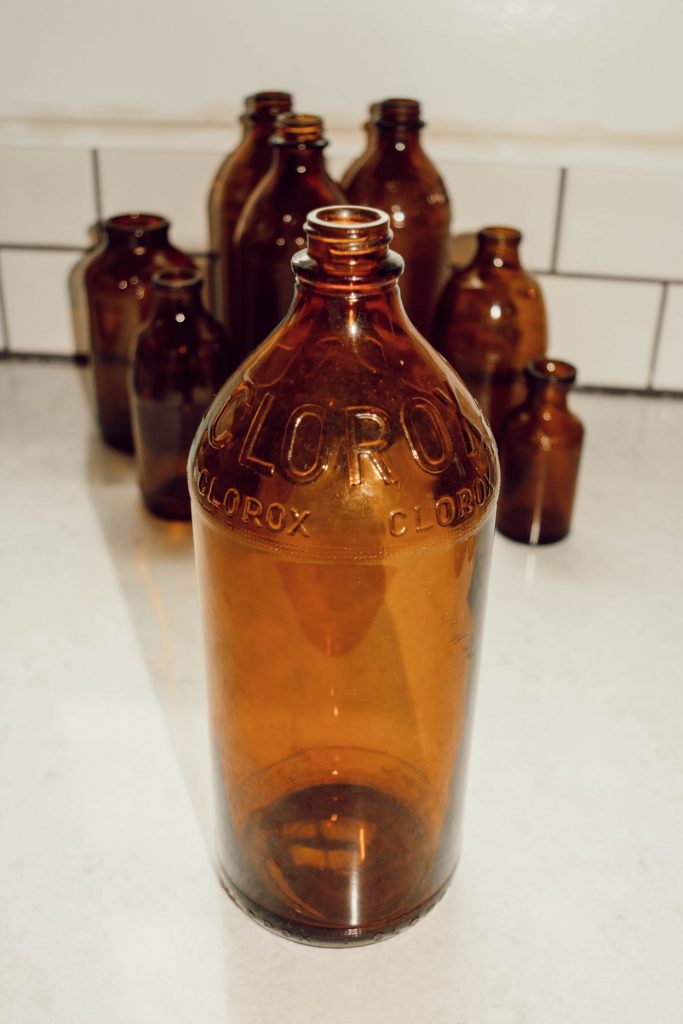 vintage brown glass clorox bottle from the 1940's and other assorted brown glass bottles
