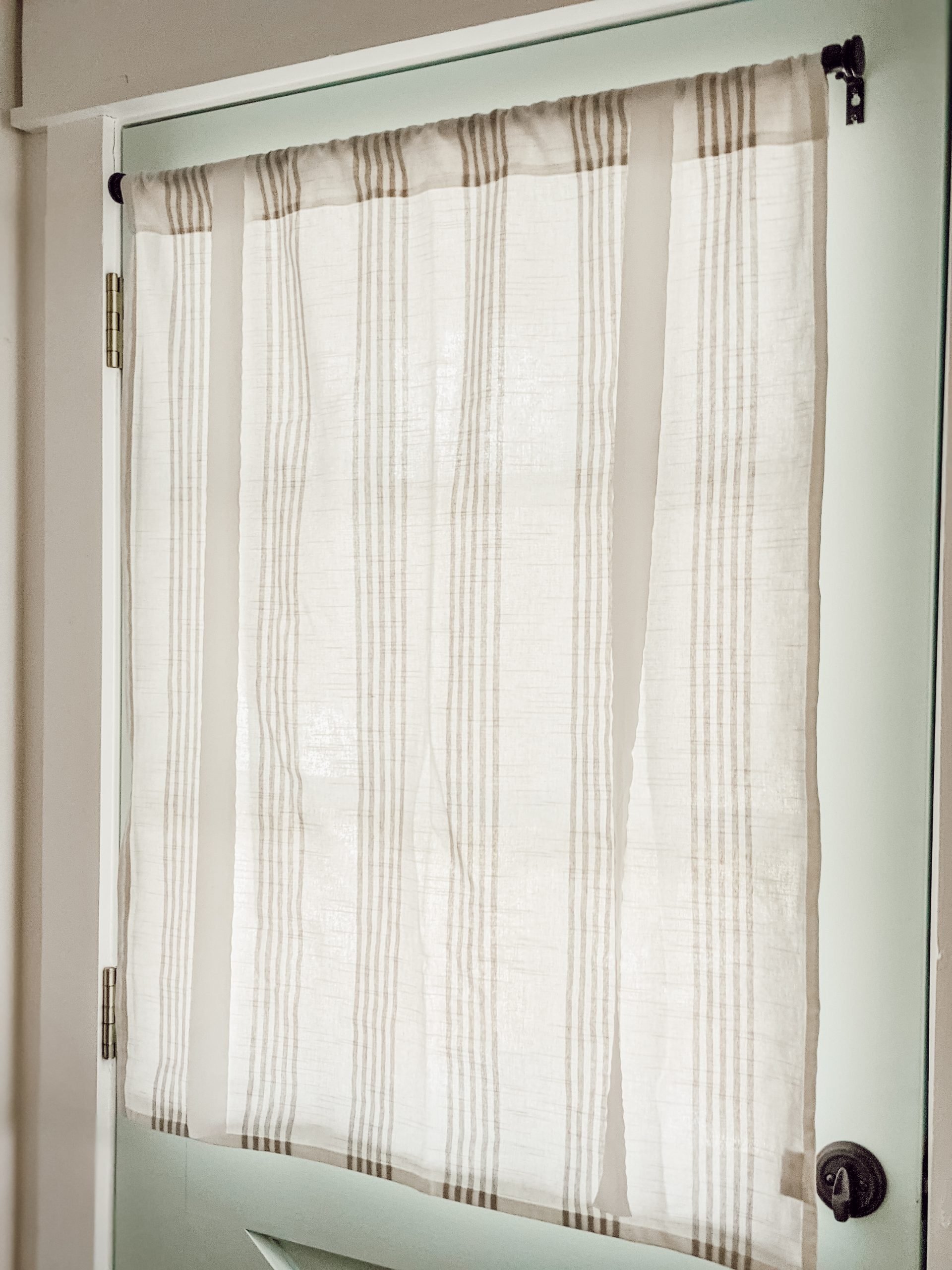 open ties on white and gray tie-up curtains