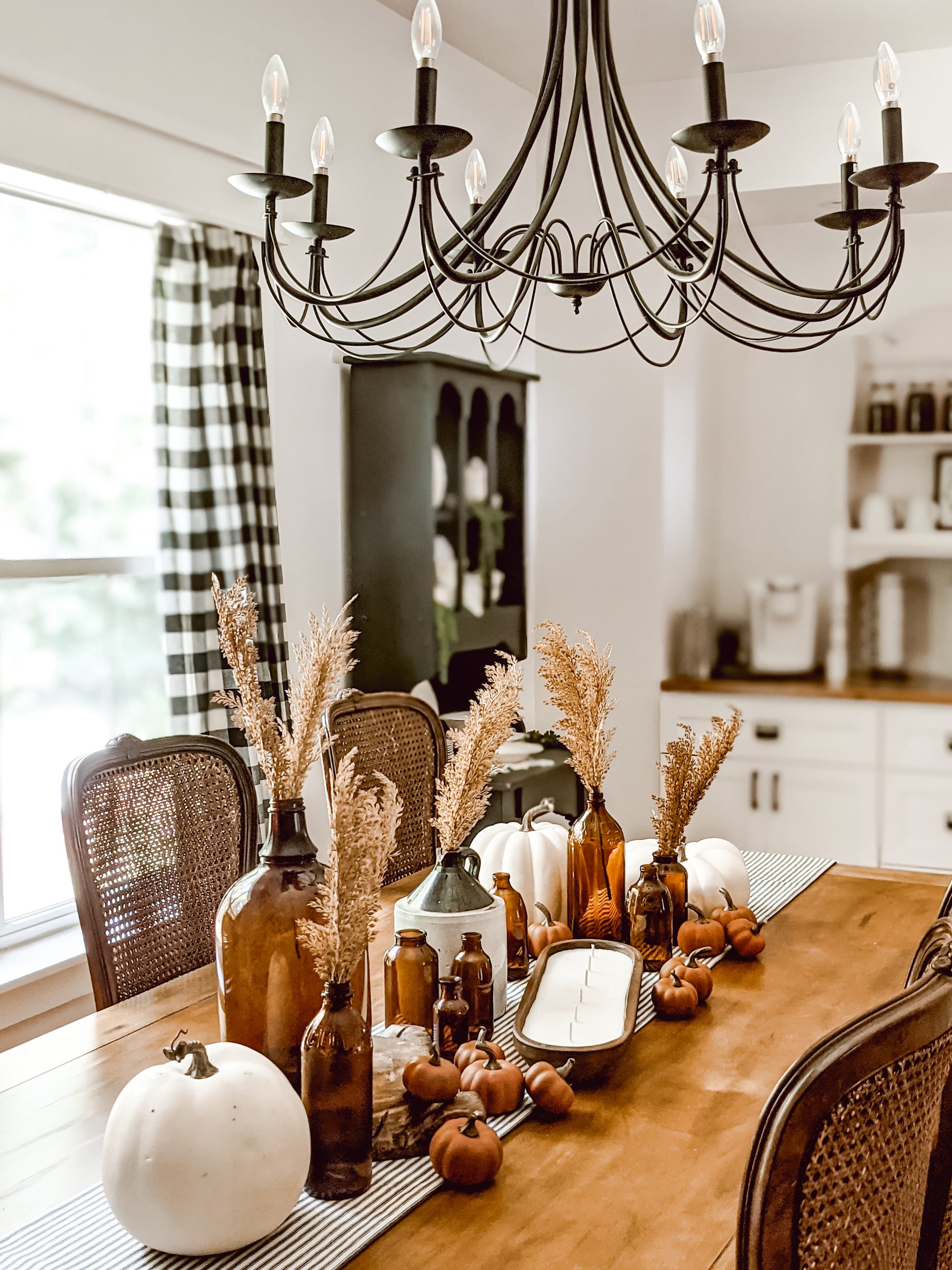 black chandelier and farmhouse dining room