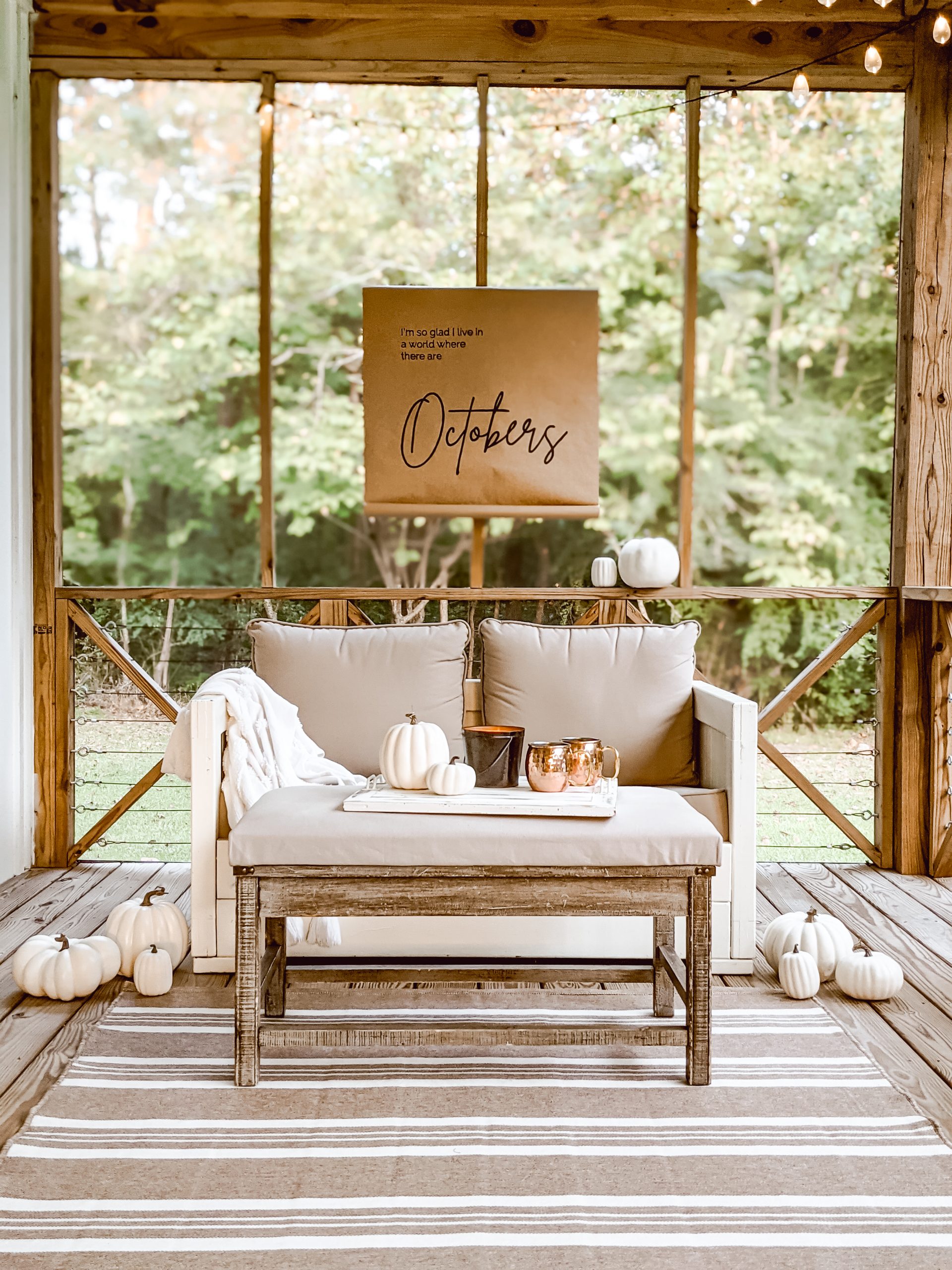 outdoor living area and neutral farmhouse style cozy fall porch decor