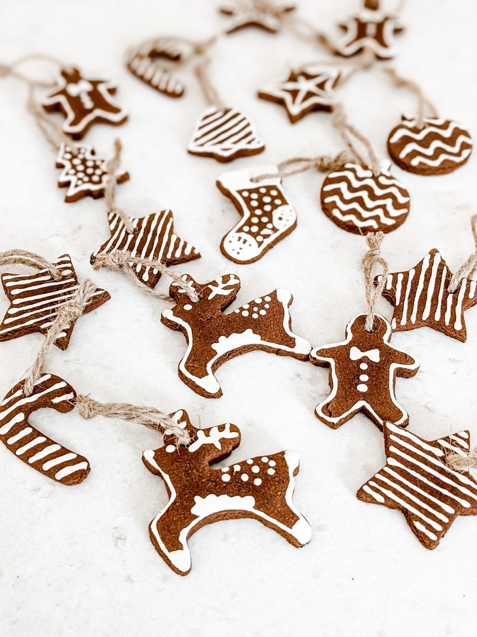 DIY Iced Gingerbread Cookie Ornaments Made with Cinnamon Dough