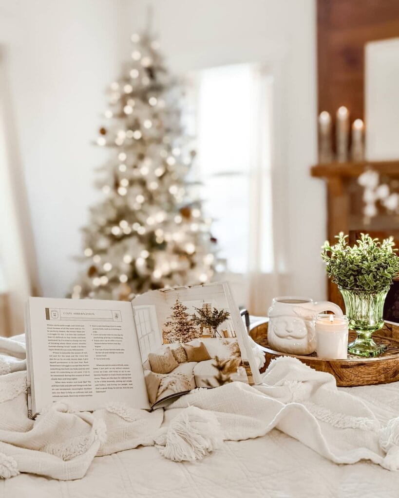 white Christmas bedroom with flocked Christmas tree and a real fireplace