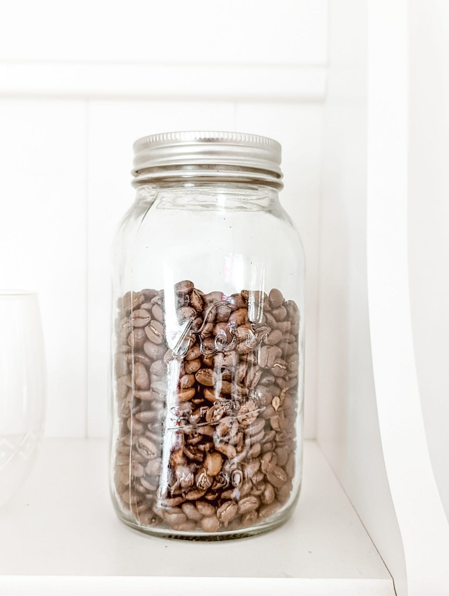 reusing old mason jars in coffee bar as storage for coffee beans