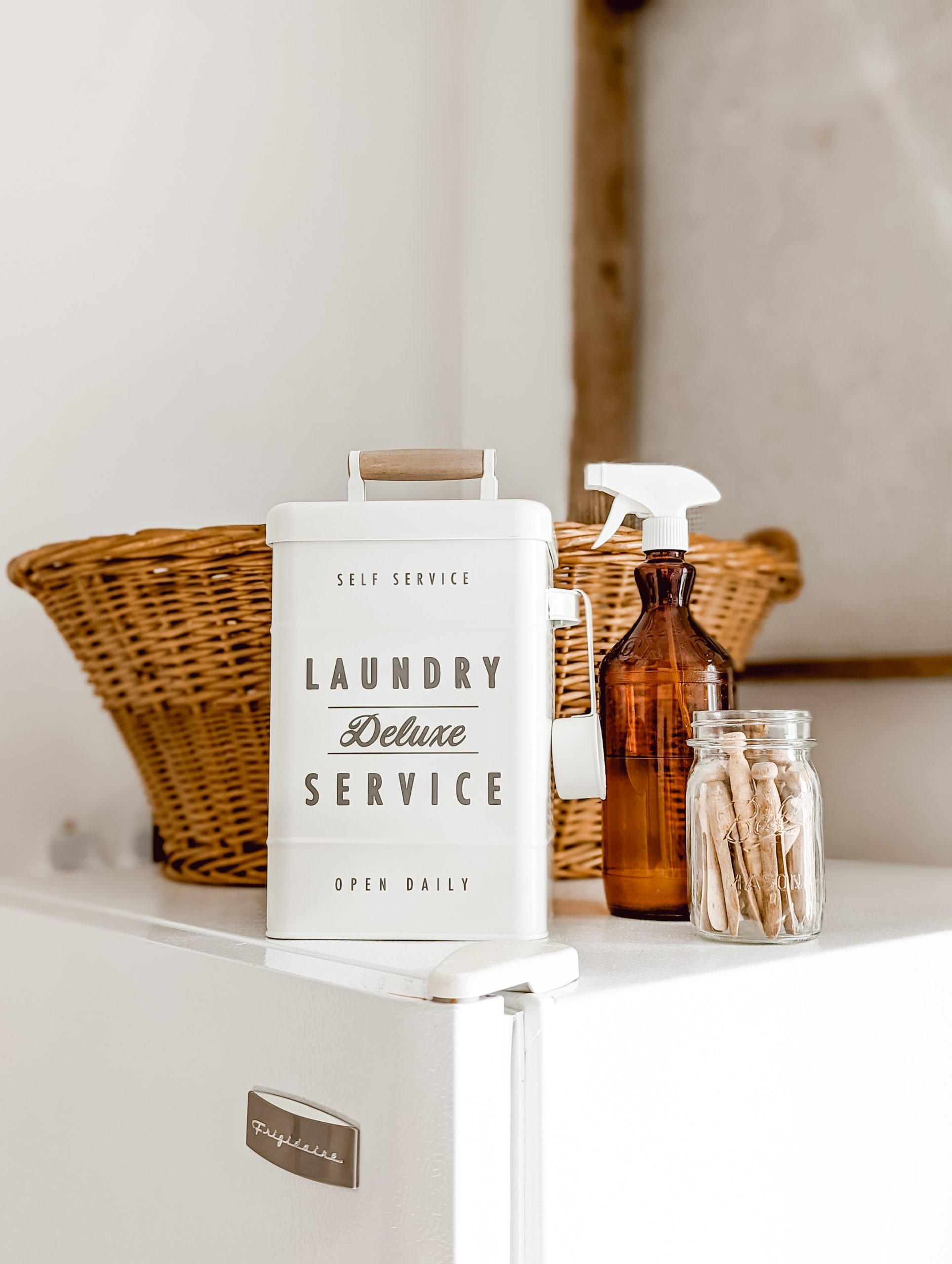 vintage amber glass Clorox bottle repurposed as a laundry stain spray bottle by adding a white spray nozzle