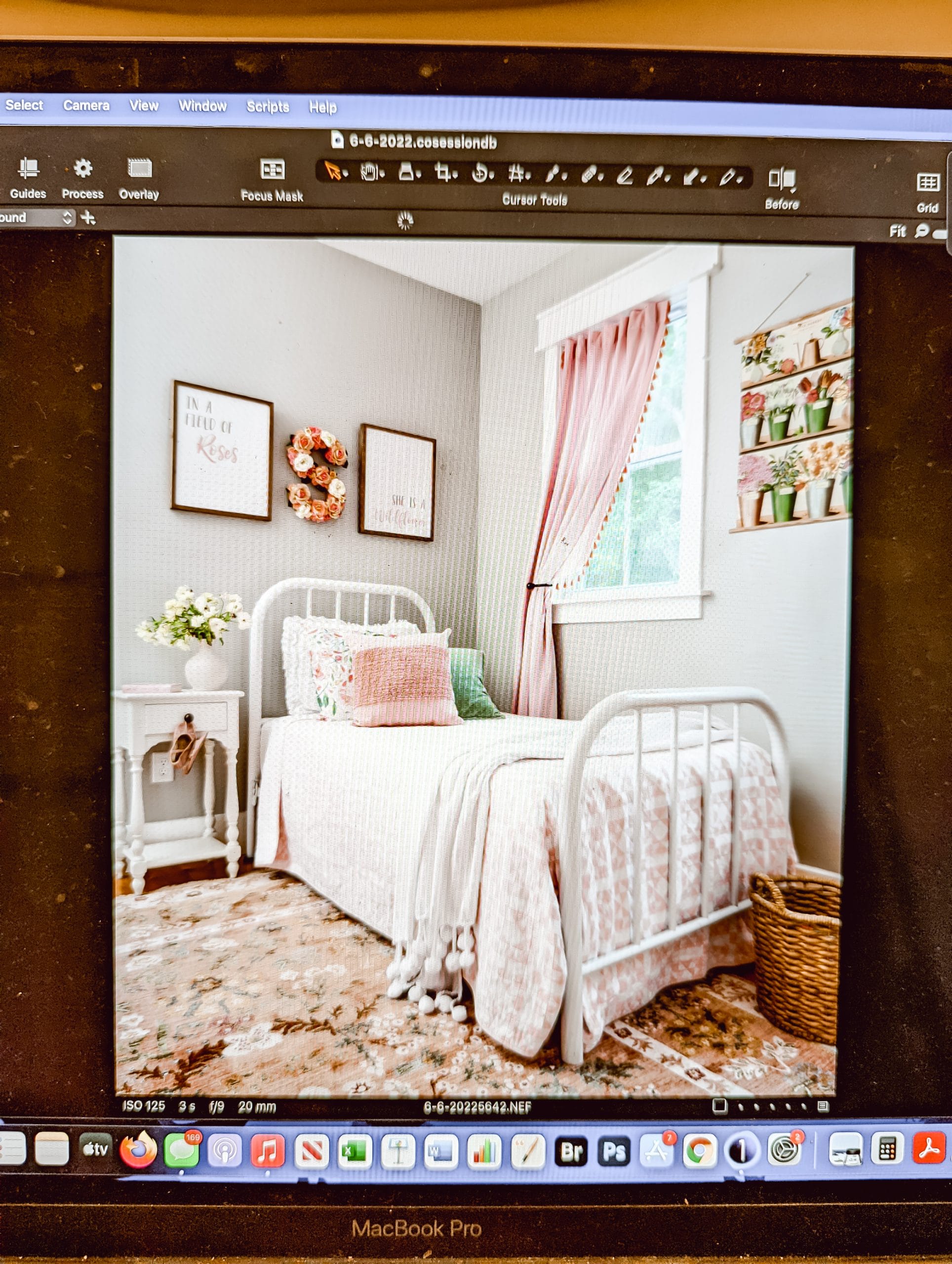computer screen showing proof of photographer's photo of a vintage cottage style little girl's bedroom in shades of pink