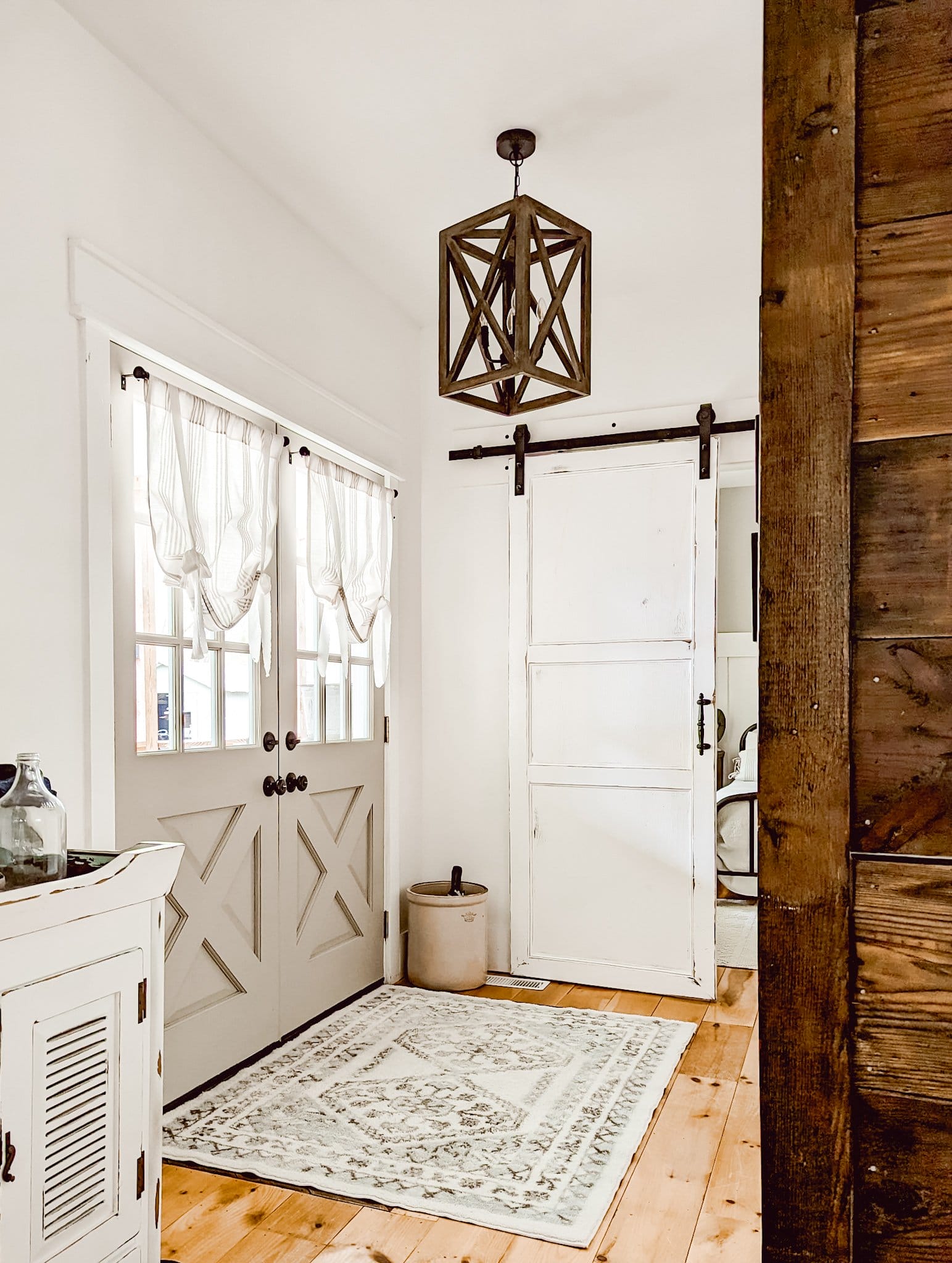 white farmhouse entryway with double front doors painted with Fusion Mineral Putty
