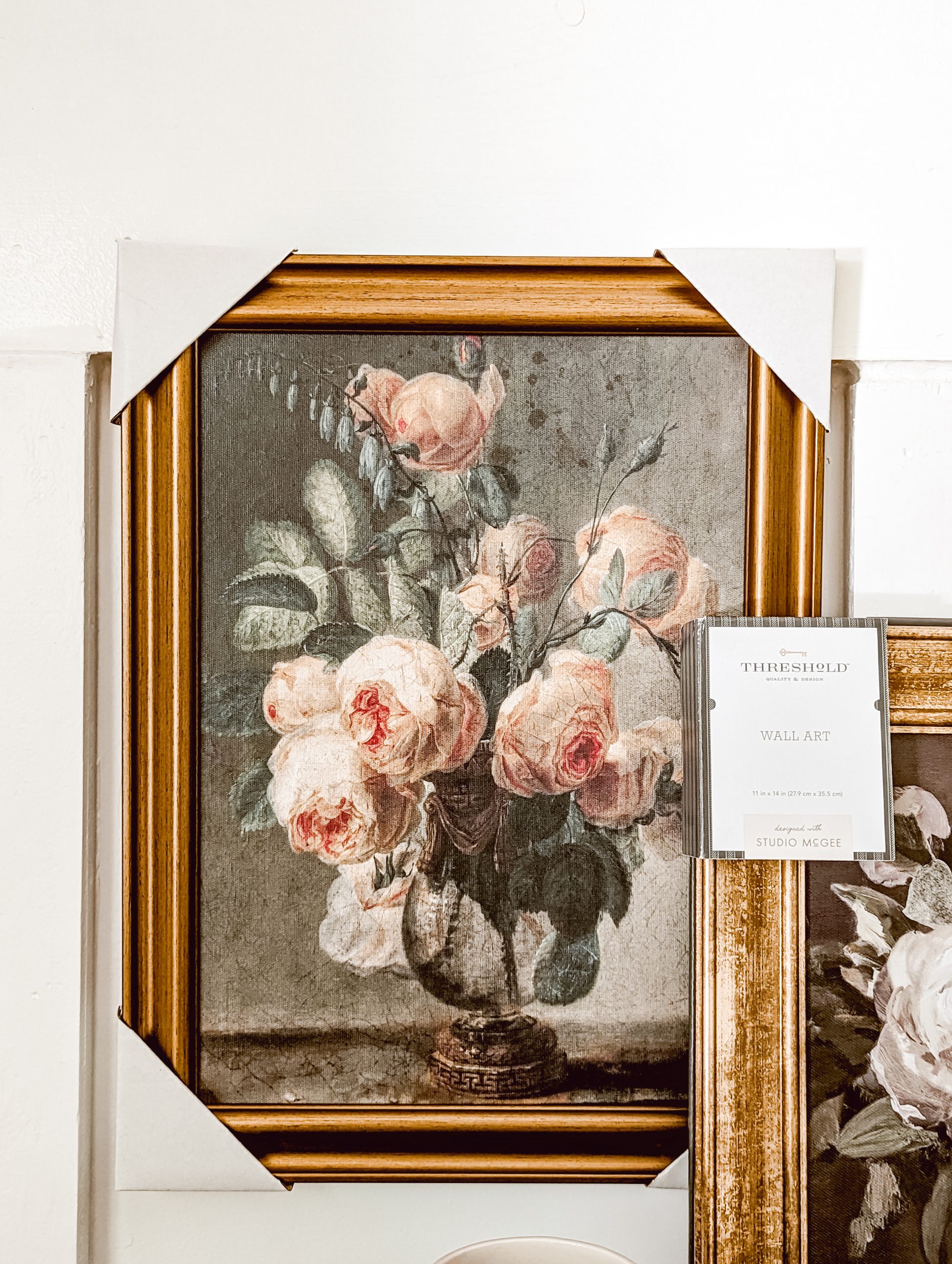 thrifted vintage style floral art in a gold frame