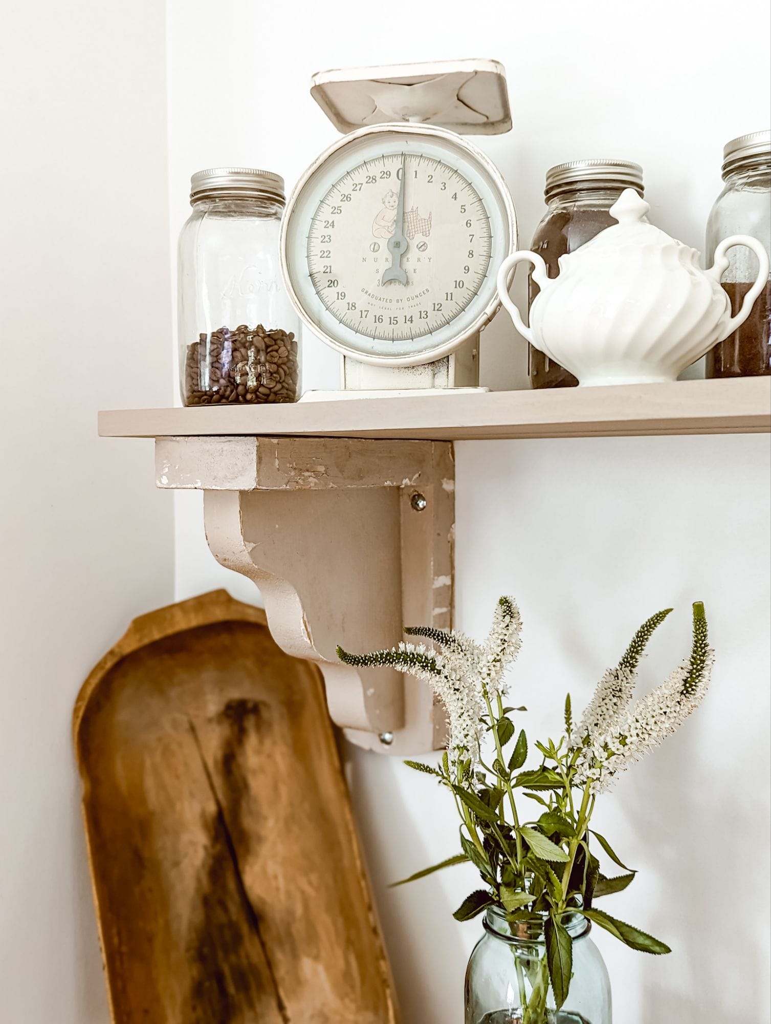 vintage wooden corbels and an unfinished DIY shelf